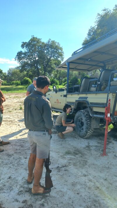 Part of the exam is mastering the practicals such changing a tyre in the bush.